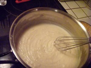 Soon-to-be-bechamel sauce. This has just one cup of milk added so far, and it's looking fairly smooth but thick. Note the whisk marks!